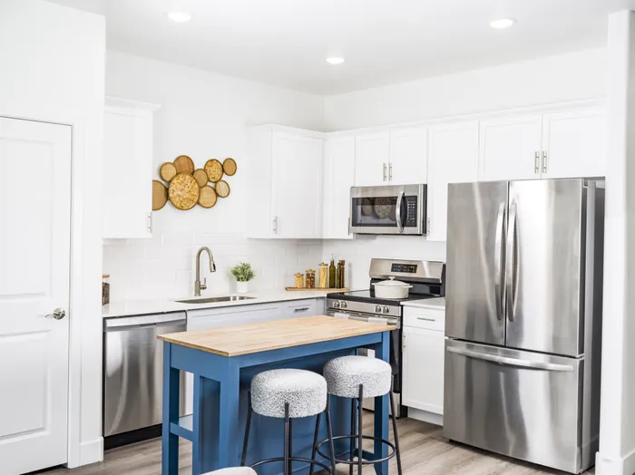 kitchen with island and stainless steel appliances at amavi aster ridge single family homes for rent in phoenix az