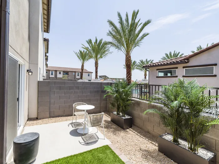 fenced in backyard space with patio and turf at amavi aster ridge single family homes for rent in phoenix az