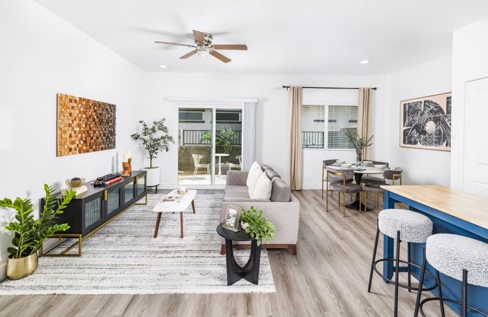 open floor plan home with modern furniture and natural light at amavi aster ridge single family homes for rent in phoenix az
