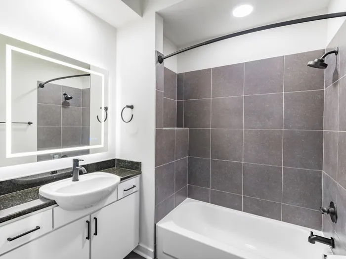 bathroom with led mirror and tiled bathtub alister uptown apartment homes for rent in charlotte nc