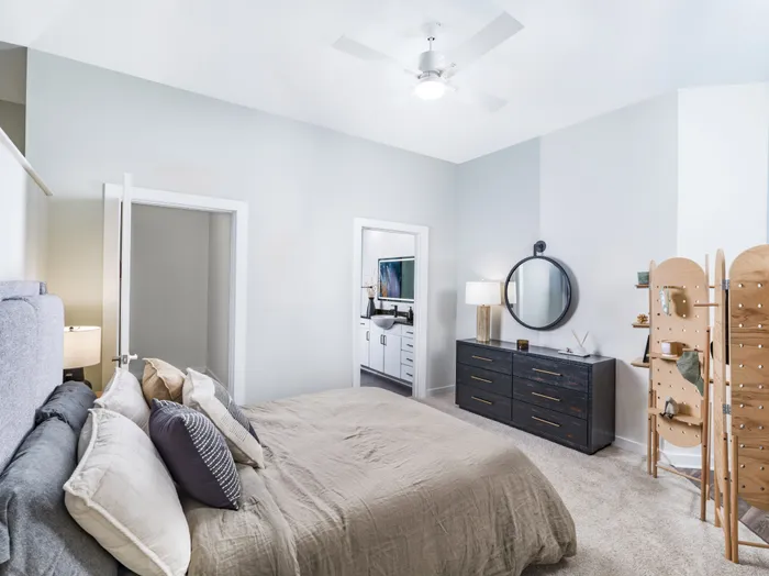 bedroom with furniture looking onto adjacent bathroom alister uptown apartment homes for rent in charlotte nc