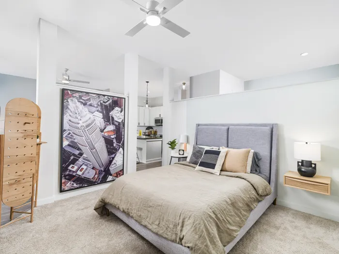spacious bedroom with furniture and ceiling fan alister uptown apartment homes for rent in charlotte nc