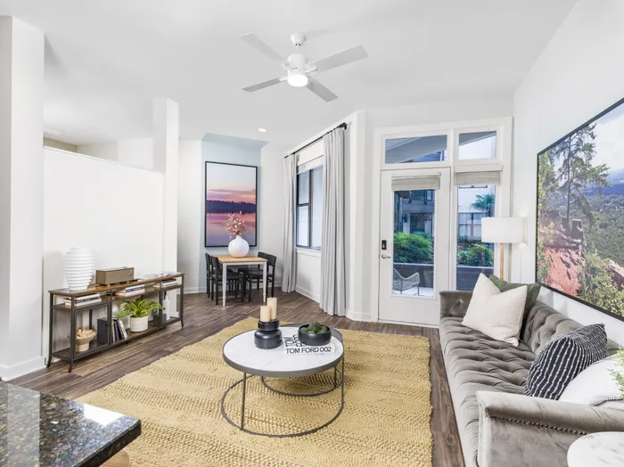 wood flooring in living room with large windows alister uptown apartment homes for rent in charlotte nc