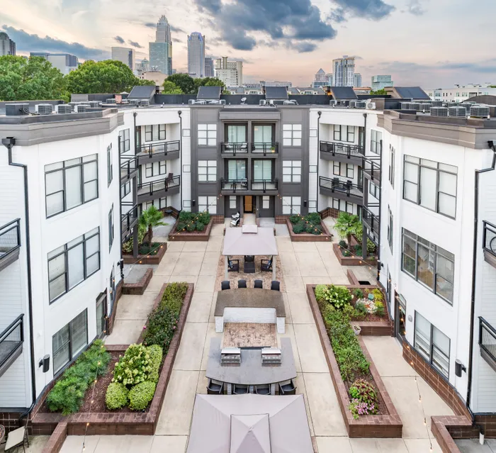 aerial view of apartment building courtyard with seating and landscaping alister uptown apartment homes for rent in charlotte nc