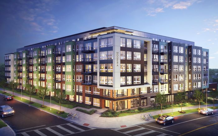 evening exterior building with adjacent streets modera h street apartment homes for rent in washington dc