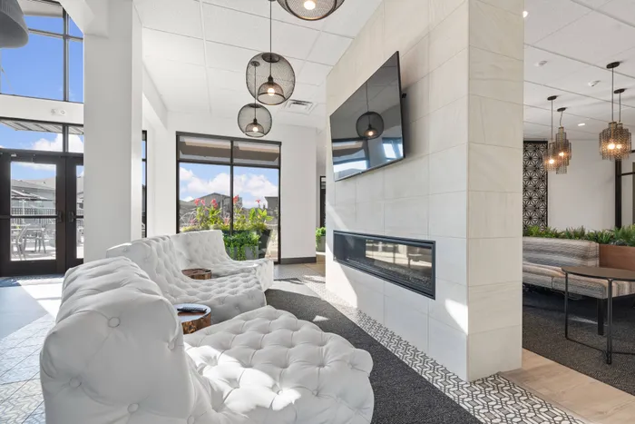 Clubhouse with couches and TV in Modern Craftsman Black Cat homes in Meridian, ID