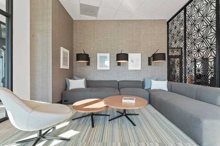 Networking Space with couch at Modern Craftsman Black Cat homes in Meridian, ID