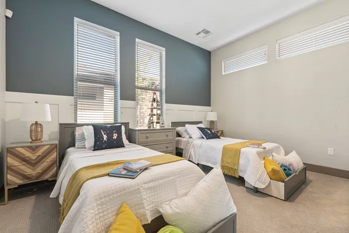 High ceilings and carpet inside bedrooms in homes at Modern Craftsman Black Cat