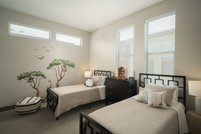 Spacious bedroom with 2 beds at Modern Craftsman Ten Mile homes in Meridian, ID
