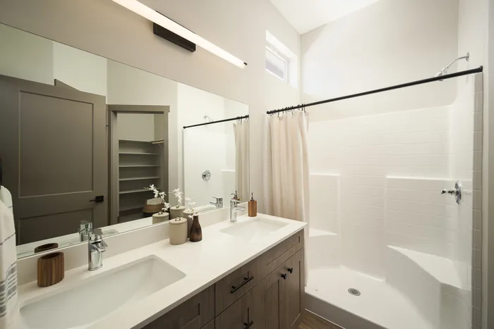 Large bathroom with closet at Modern Craftsman Ten Mile homes in Meridian, ID