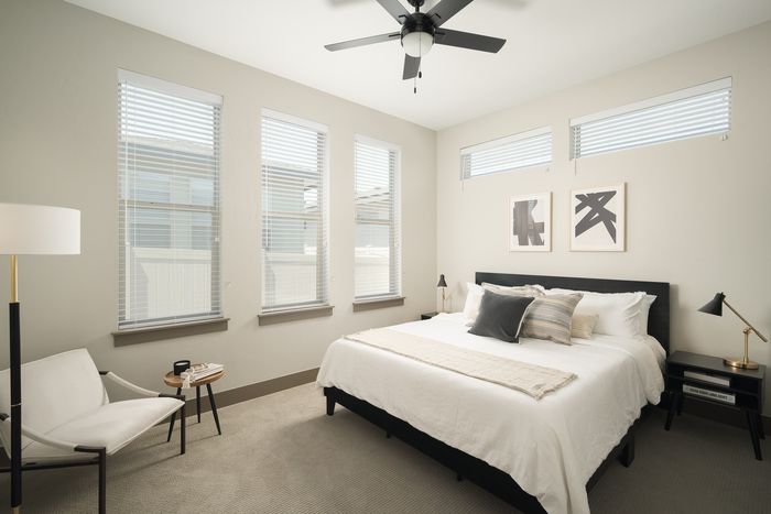 Bed with ceiling fan at Modern Craftsman Ten Mile homes in Meridian, ID