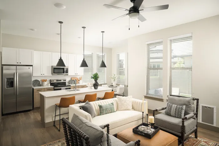 Living Room with ceiling fan at Modern Craftsman Ten Mile homes in Meridian, ID