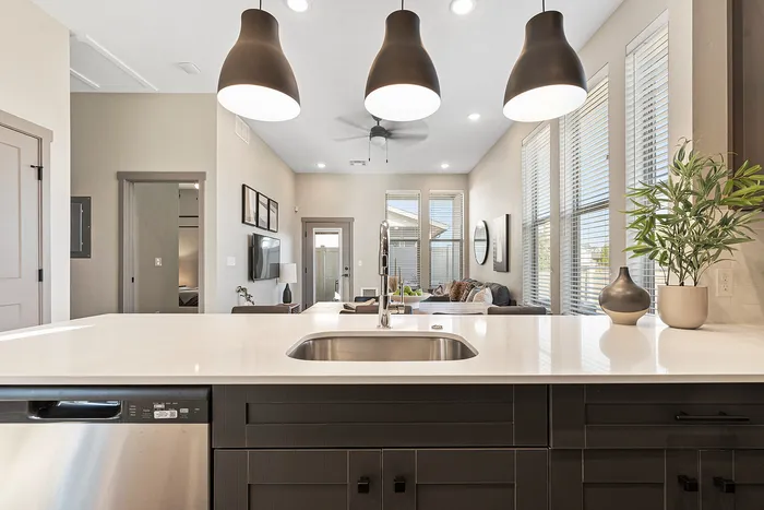Kitchen with pendant lighting at Modern Craftsman Black Cat homes in Meridian, ID