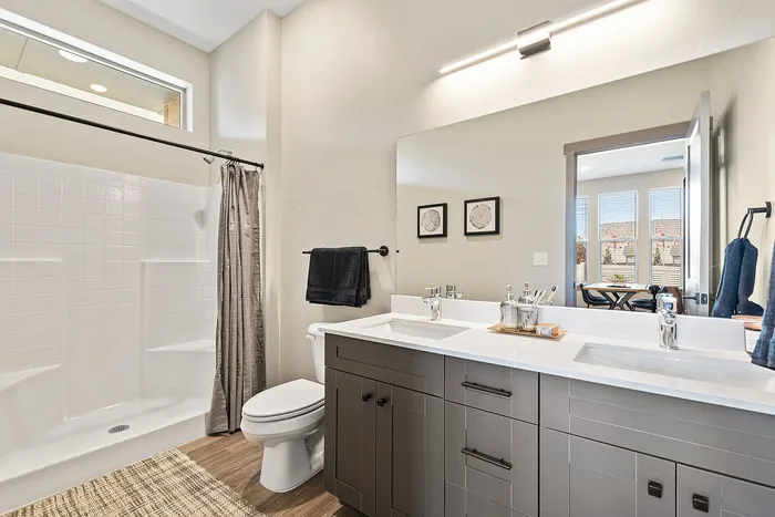 Spacious bathrooms with double vanities at Modern Craftsman Black Cat