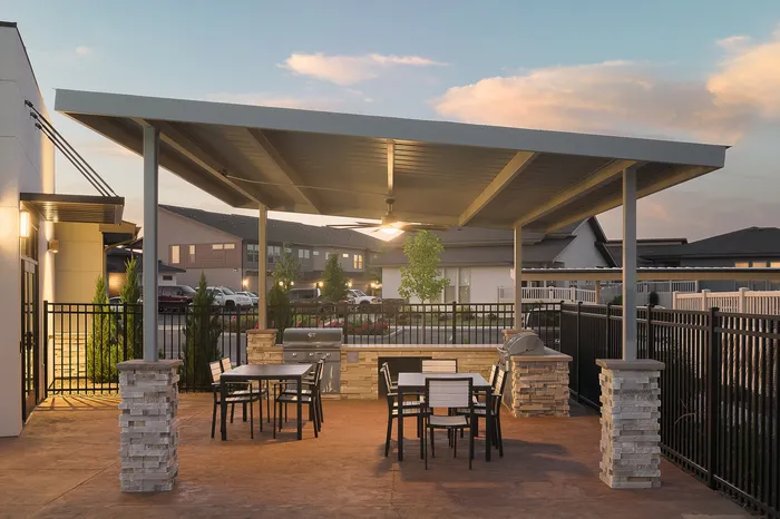 Outdoor Kitchen with grills at Modern Craftsman Black Cat homes in Meridian, ID