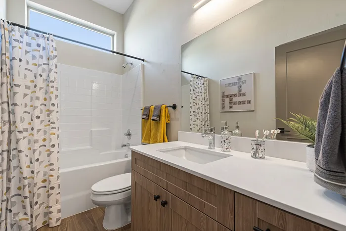 Spacious home bathrooms with ample countertop space inside homes at Modern Craftsman Black Cat