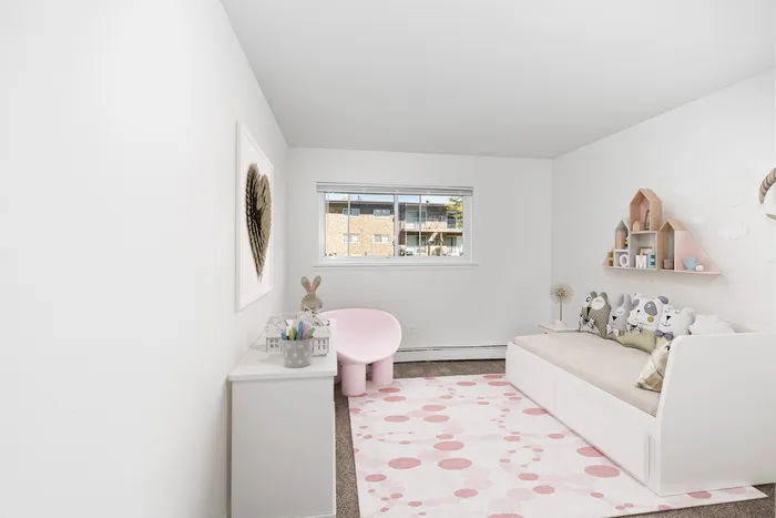 Justice, IL, Apartments Near Hickory Hills - Willow Hill Apartments - Bright Children's Bedroom With White Daybed, Wall Art, Pink Chair, Dresser, Pink Area Rug, Wall Shelves, and Large Window.