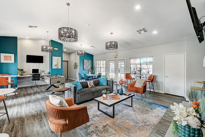 Inviting lounge area with modern decor, cozy seating, and vibrant accents, perfect for relaxation and entertainment.