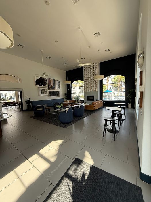 Spacious and stylish lobby featuring modern seating, large windows, and elegant decor accents.