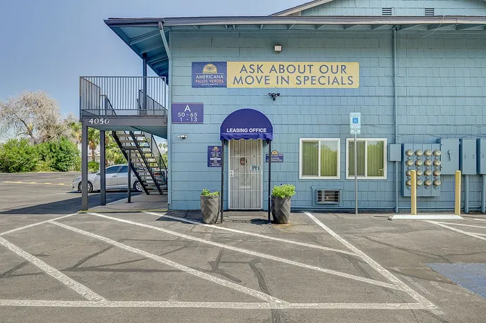Inviting leasing office of Americana Palos Verdes Apartments with welcoming signage and convenient parking.