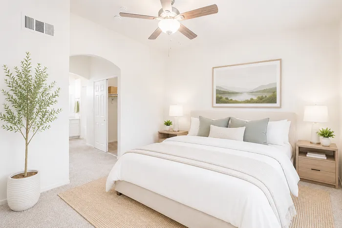Elegant bedroom with a serene ambiance, featuring a cozy bed, stylish decor, and lush greenery, perfect for relaxation.