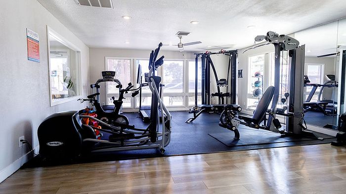 Bright and modern fitness center with state-of-the-art cardio and strength machines, perfect for energizing workouts.