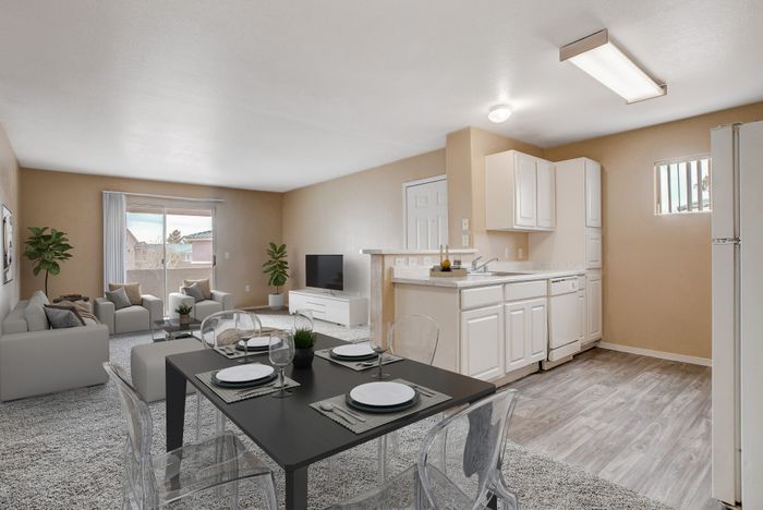 Bright and airy open-plan living room and kitchen with modern decor, elegant dining area, and light streaming through large sliding doors.