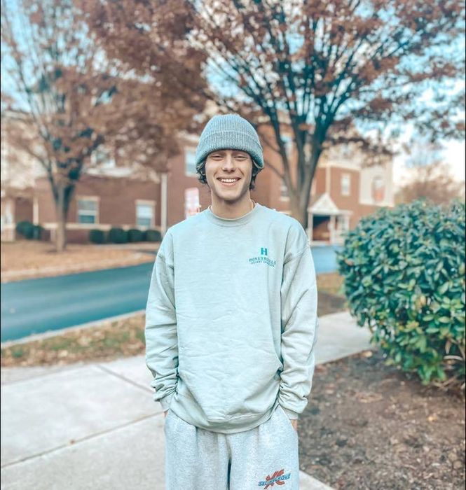 A person with a beanie smiling