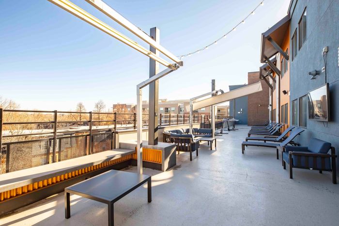 Rooftop lounge with seating overlooking the city of Fort Collins at Union on Alley.