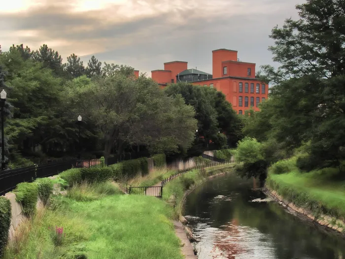 Walking path near our student apartments for rent near Syracuse University, featuring a path along the water.