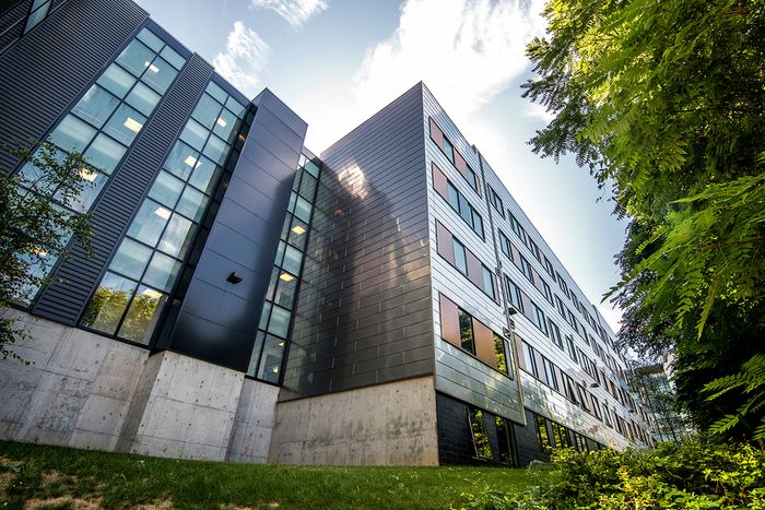 The exterior of our student apartments in Syracuse, featuring a view of the modern exterior and the streets.