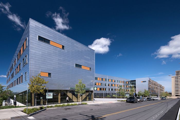 The exterior of our student apartments in Syracuse, featuring a view of the modern exterior and the streets.