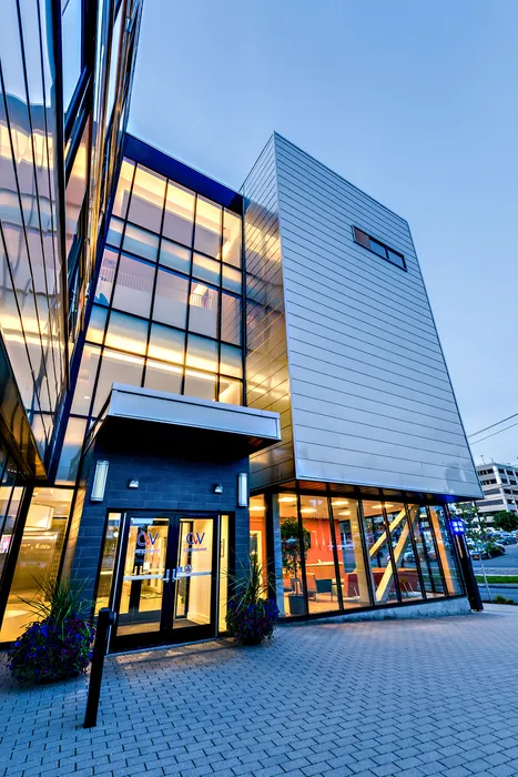 The exterior of our student apartments in Syracuse, featuring a view of the modern exterior and the streets.