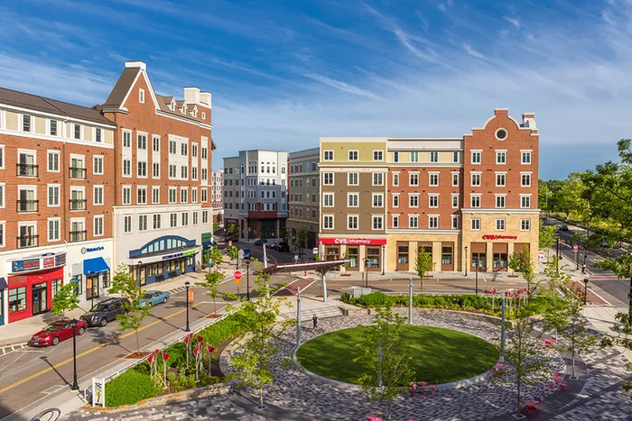 Plaza near our UConn student apartments near campus, featuring a view of a public sculpture and downtown streets.