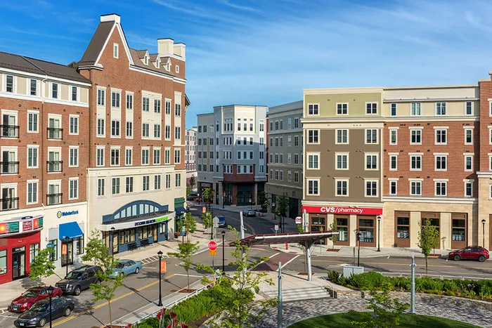 Plaza near our UConn student apartments near campus, featuring a view of a public sculpture and downtown streets.