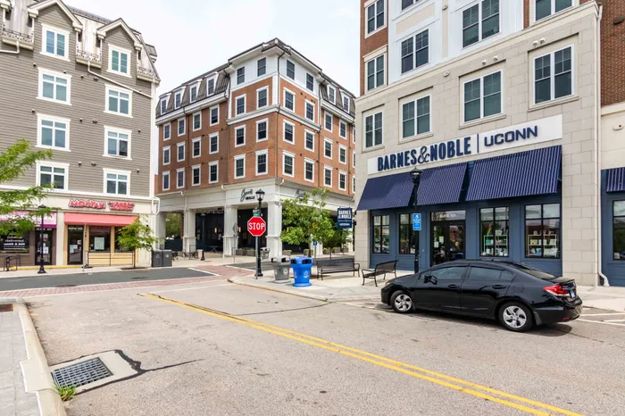 Plaza near our UConn student apartments near campus, featuring a view of a public sculpture and downtown streets.