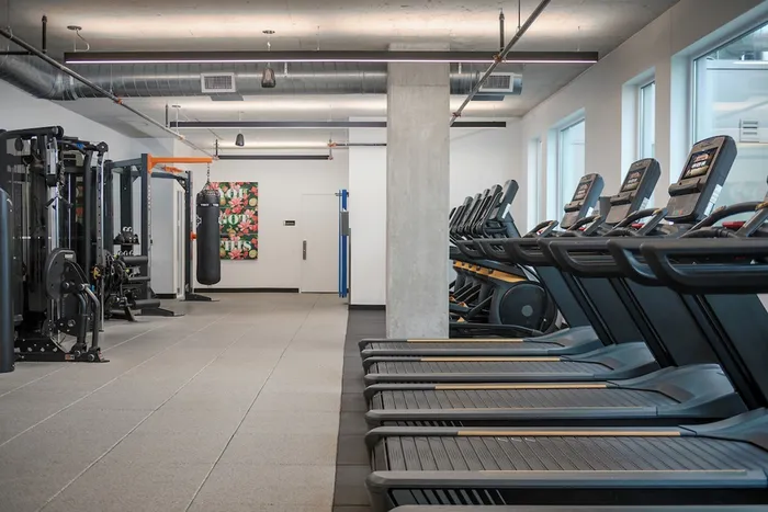 Fitness Center with treadmills, ellipticals, and various work out machines