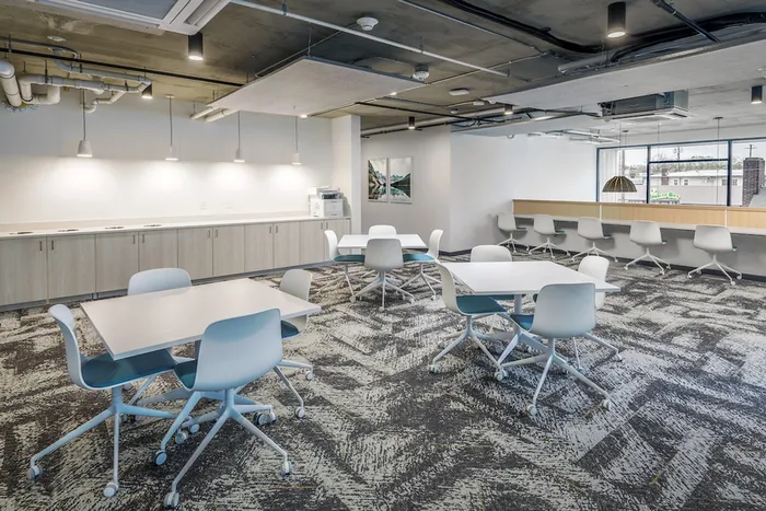 Community clubhouse with white tables and chairs