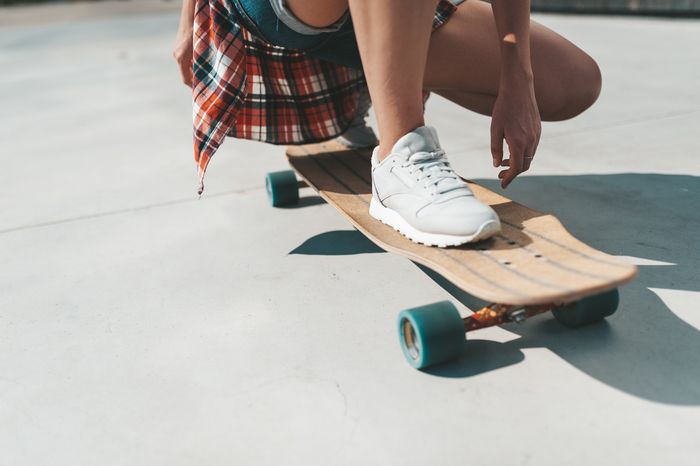 Close up of someone riding a longboard