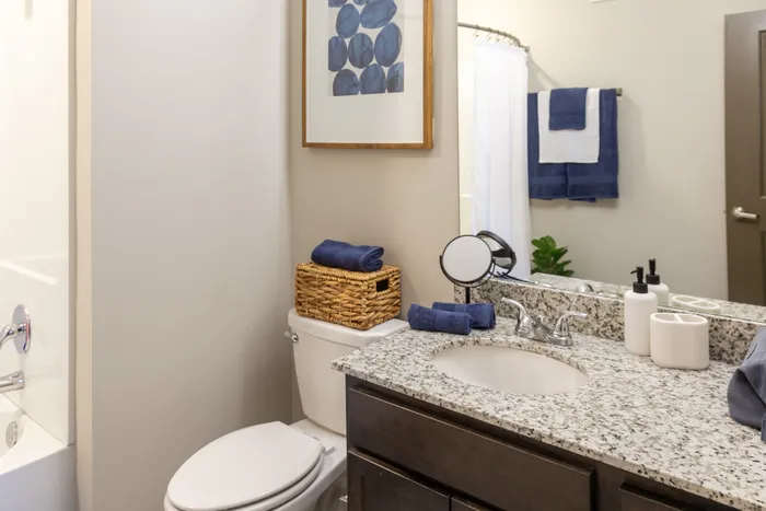 Bathroom with blue towels at College View Mississippi State student apartments.