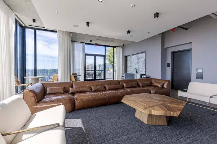 Clubhouse seating with chairs, couches, lounge chairs, and tables for residents to use