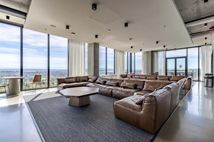Clubhouse seating with chairs, couches, lounge chairs, and tables for residents to use