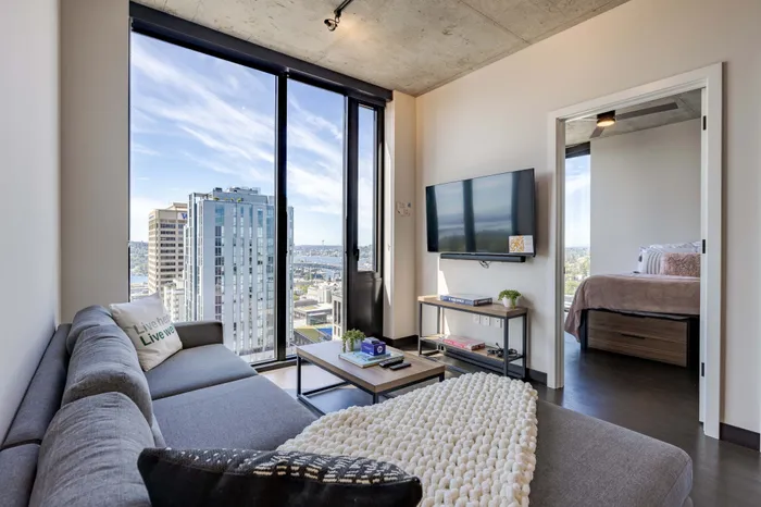 Model apartment living room looking out at the Seattle city views