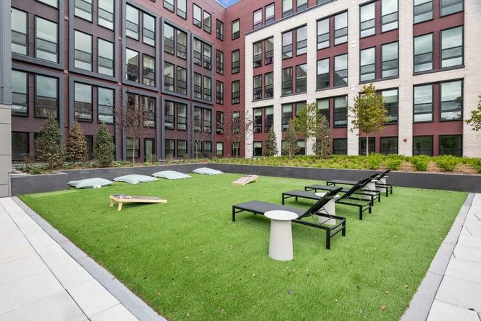 Courtyard lounge with cornholes