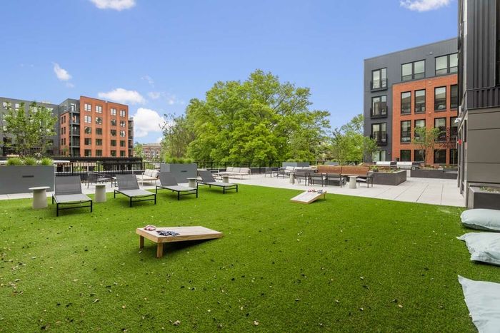 Courtyard lounge with cornhole boards