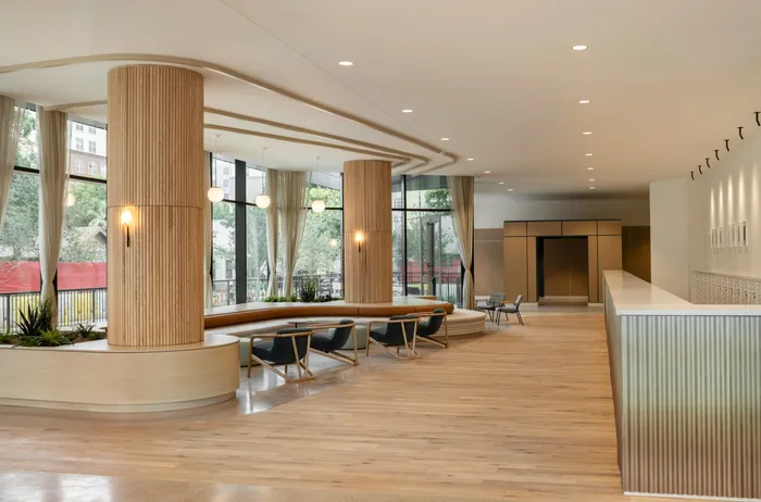 Clubhouse with seating that looks out of the large floor to ceiling windows at the city of Austin, TX.