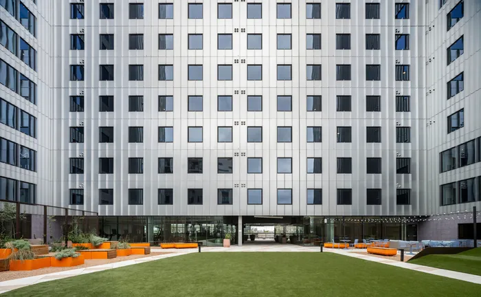 The green space outside of the building