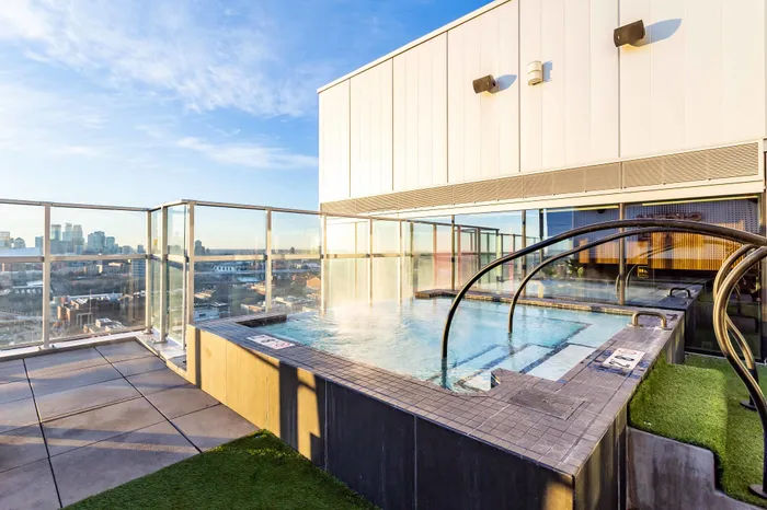 Hub Minneapolis student apartments in Minneapolis featuring a rooftop hot tub with city views.