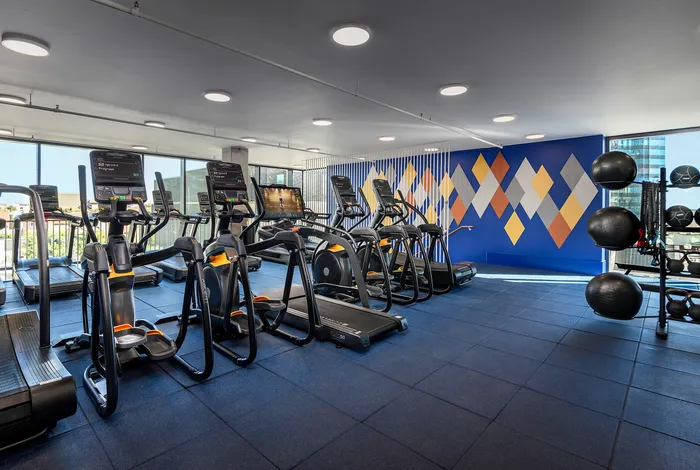 Fitness center cardio area with treadmills and ellipticals