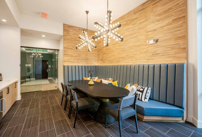 Clubhouse kitchen with a large table for residents to enjoy